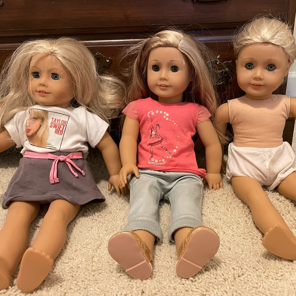 2 American girl dolls and 3 dolls total $100